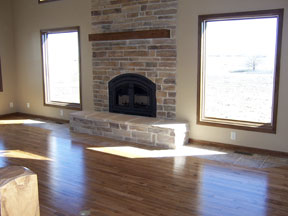 brick fireplace with wood mantel