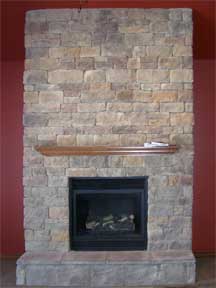 stone fireplace with wood mantel