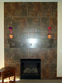 custom tile fireplace with dark wood mantel