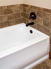 tiled tub with oil bronzed hardware
