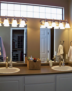 his and her sinks with custom block glass window