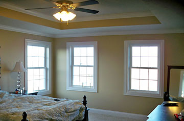 master bedroom with coffered ceiling