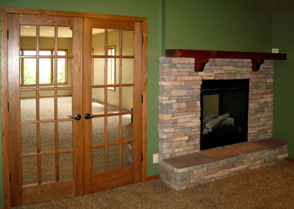 office with french doors and see-through fireplace